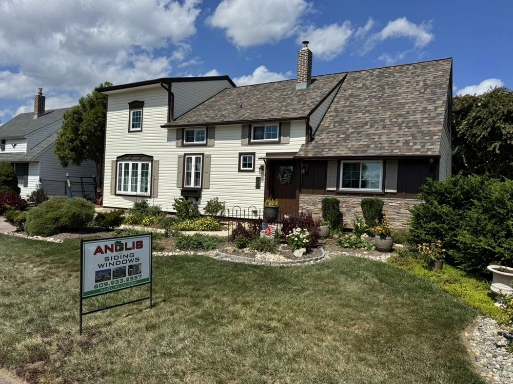 Front exterior of a home showcasing siding installation and energy efficient windows